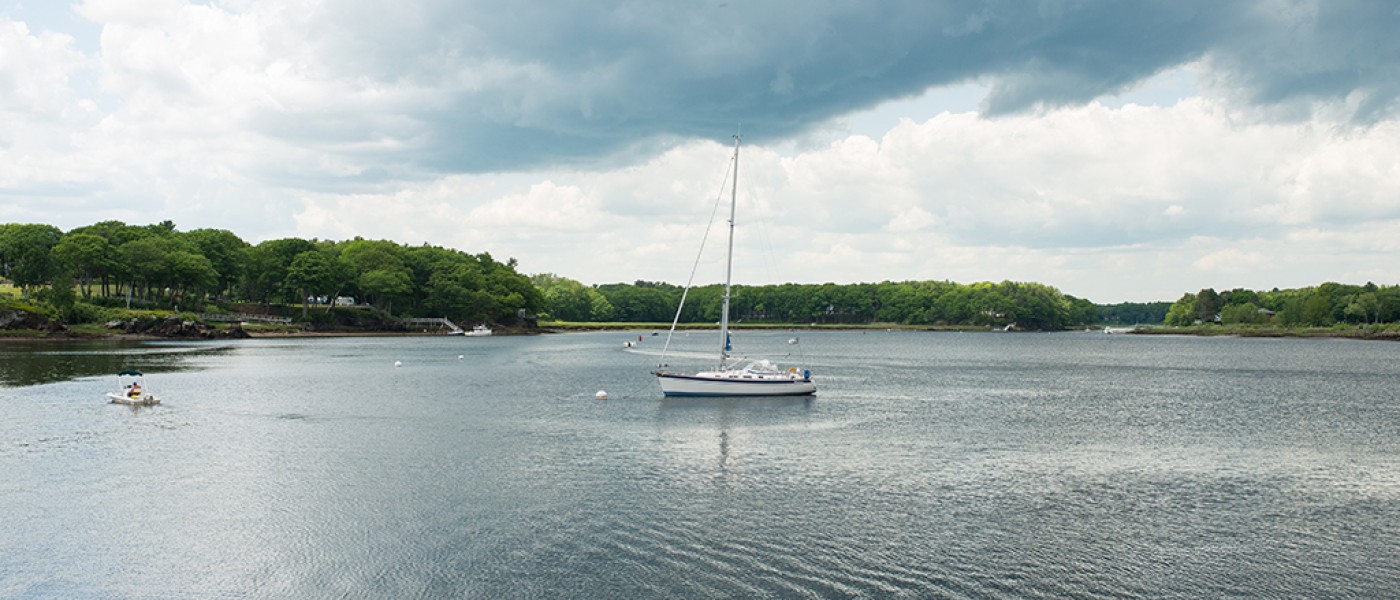 A boat in the river off the Biddeford Campus