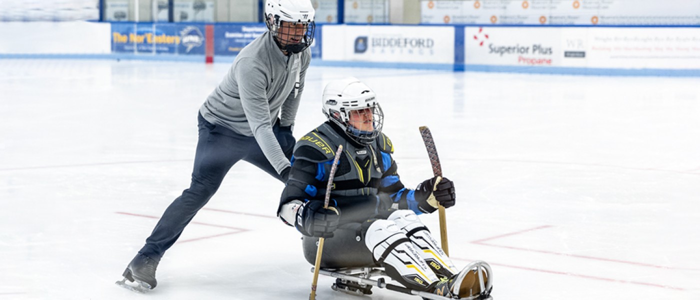 UNE Doctor of Physical Therapy students help out with a Maine Adaptive Sledding event at the Harold Alfond Forum