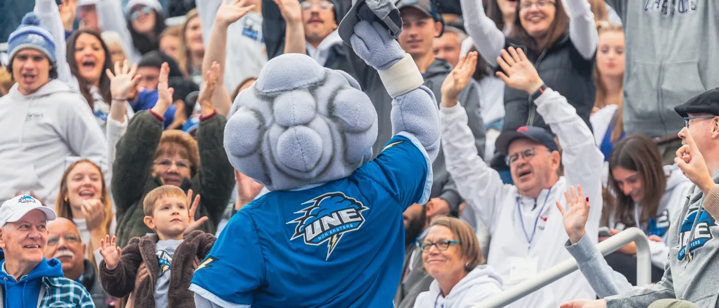 U N E mascot, Stormin' Norman, energizes a football crowd