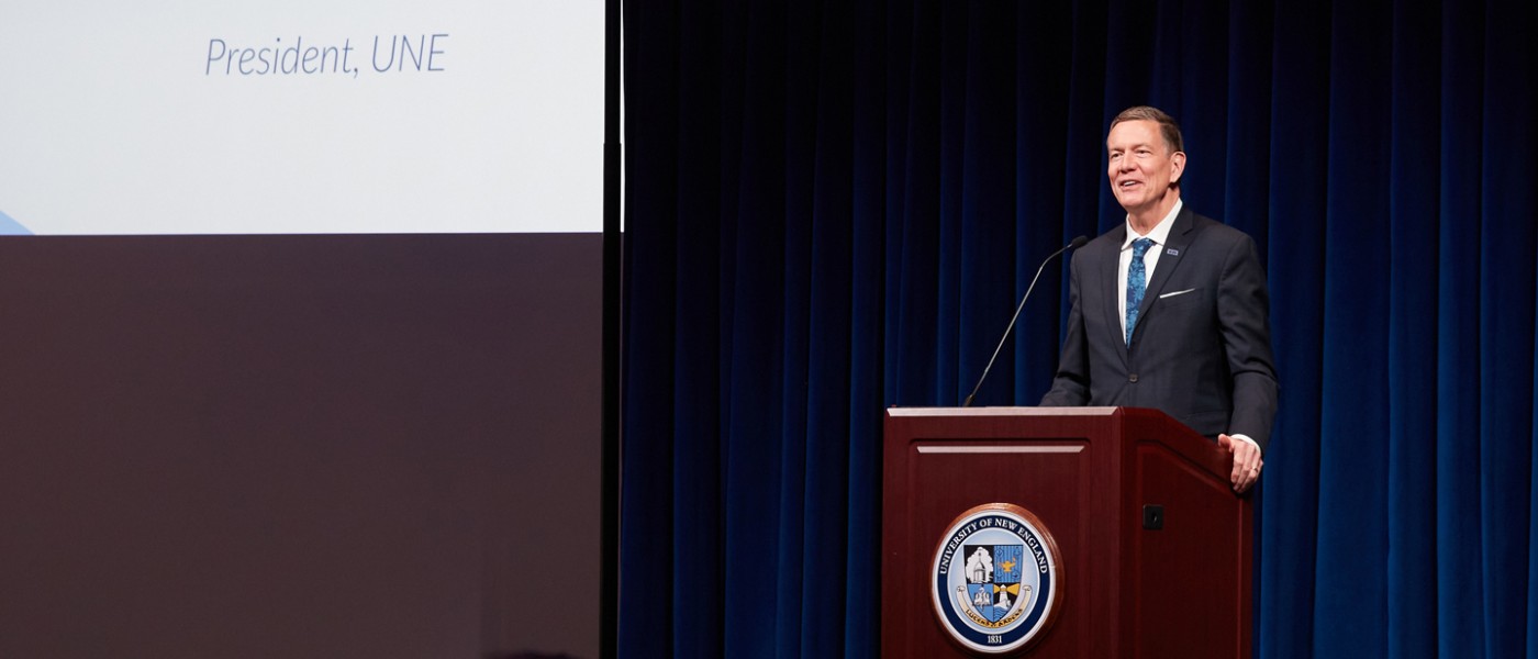 President Herbert speaking at the podium during the Innovation Showcase