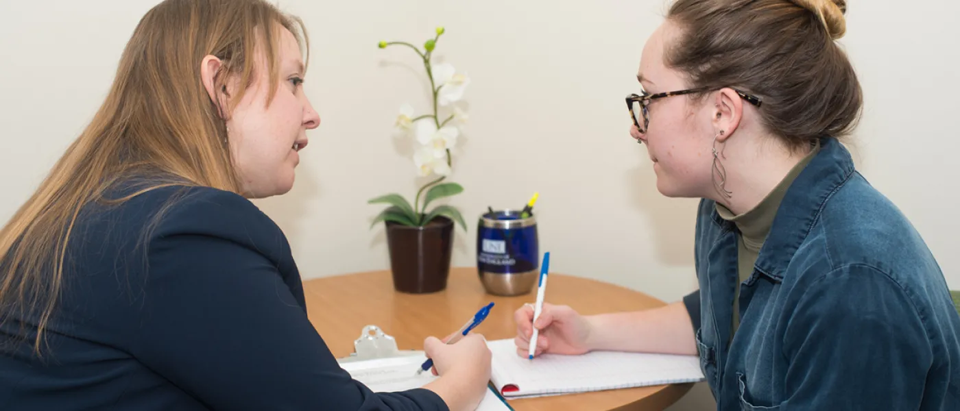 A counselor speaks with a student