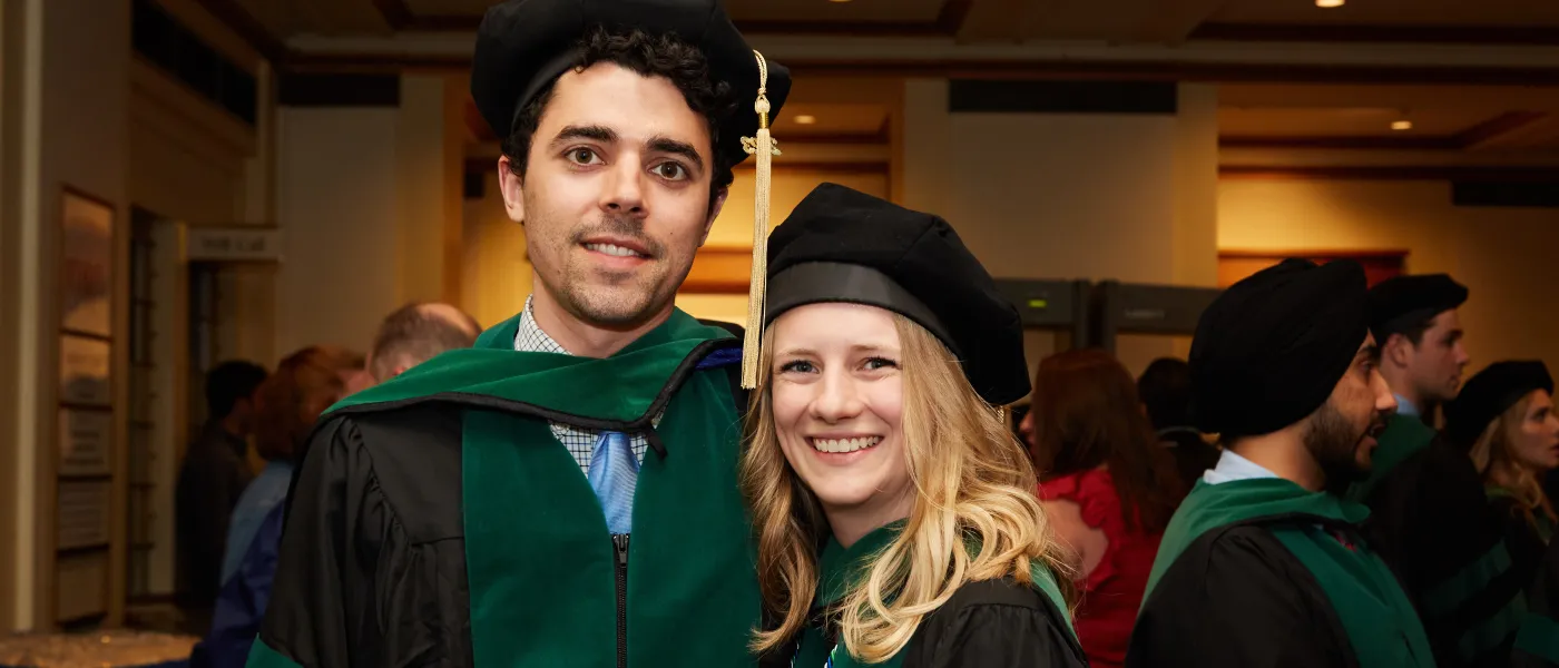 UNE COM graduates pose at Merrill Auditorium in Portland