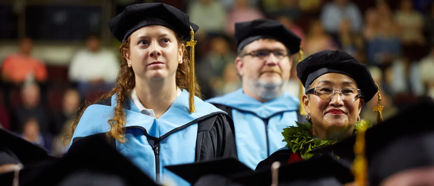 Graduates look on during the ceremony