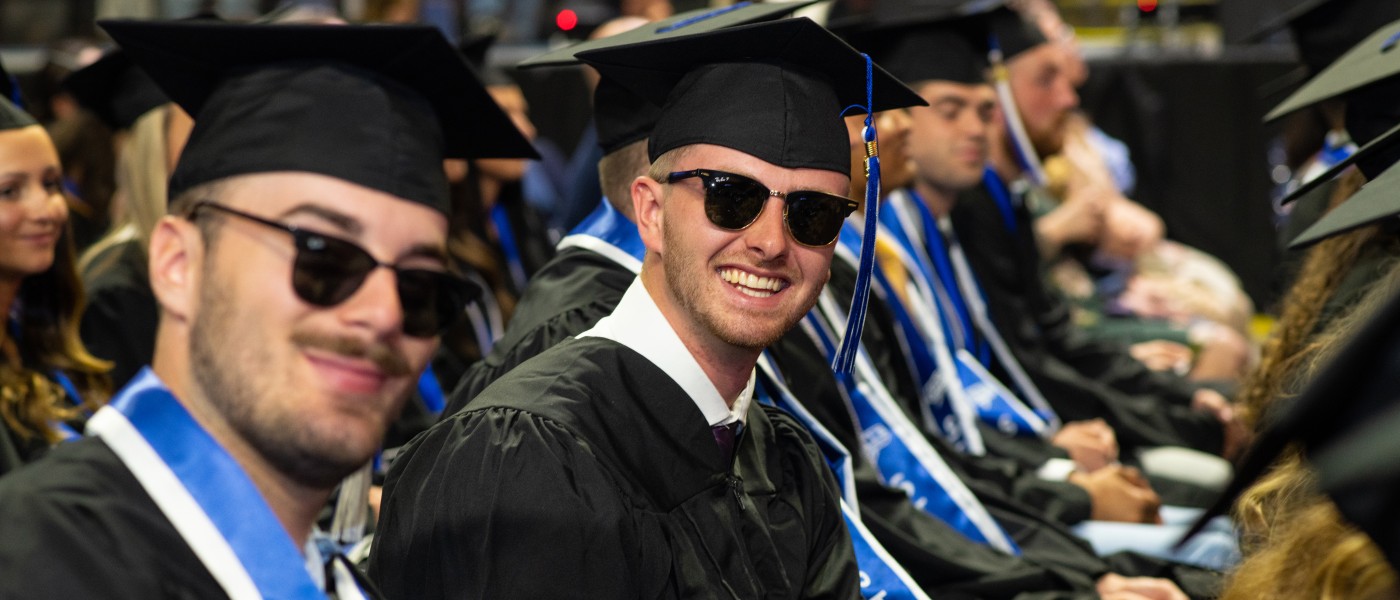 UNE graduates cheer at the Cross Insurance Arena in Portland