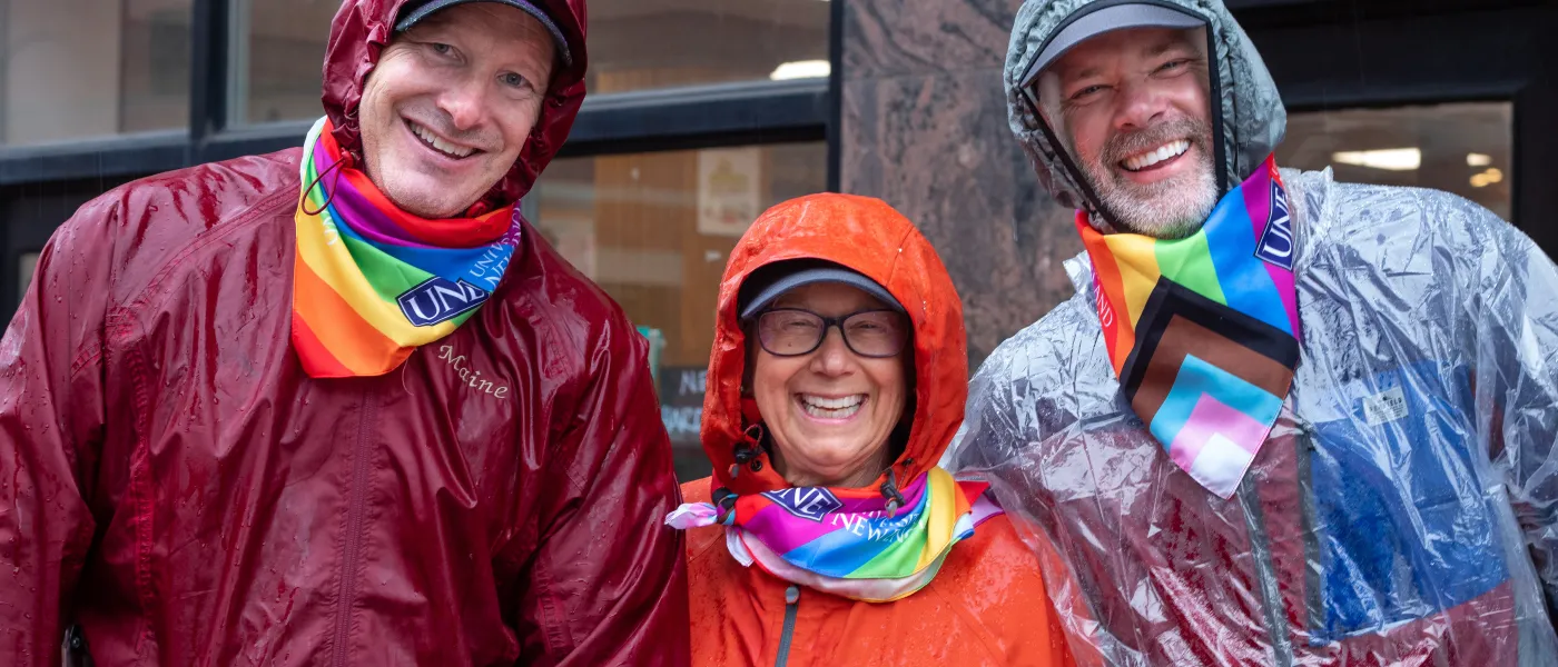 Three UNE participants pose for a photo