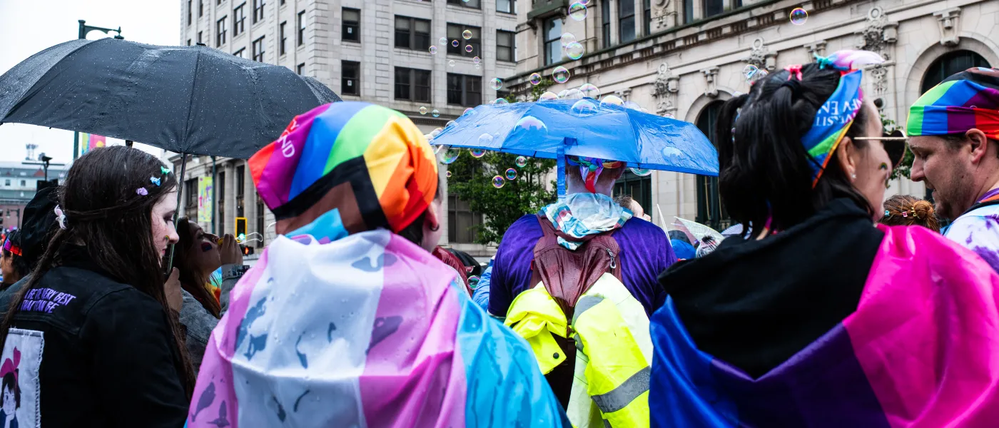 UNE participants march surrounded by bubbles