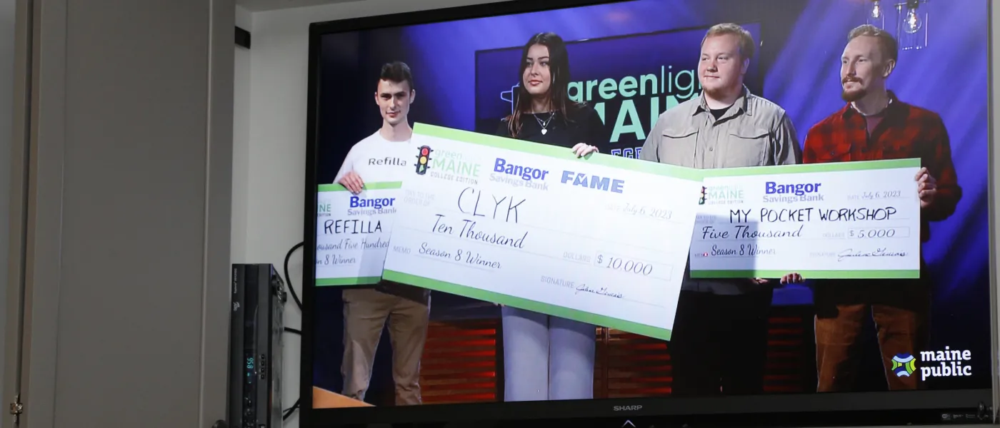 Anderson is shown on the television holding the winning, $10,000 check. Her competitors are pictured with 2nd and 3rd-place checks.