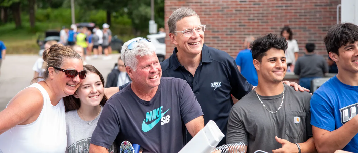 President Herbert poses with current and new students and their family