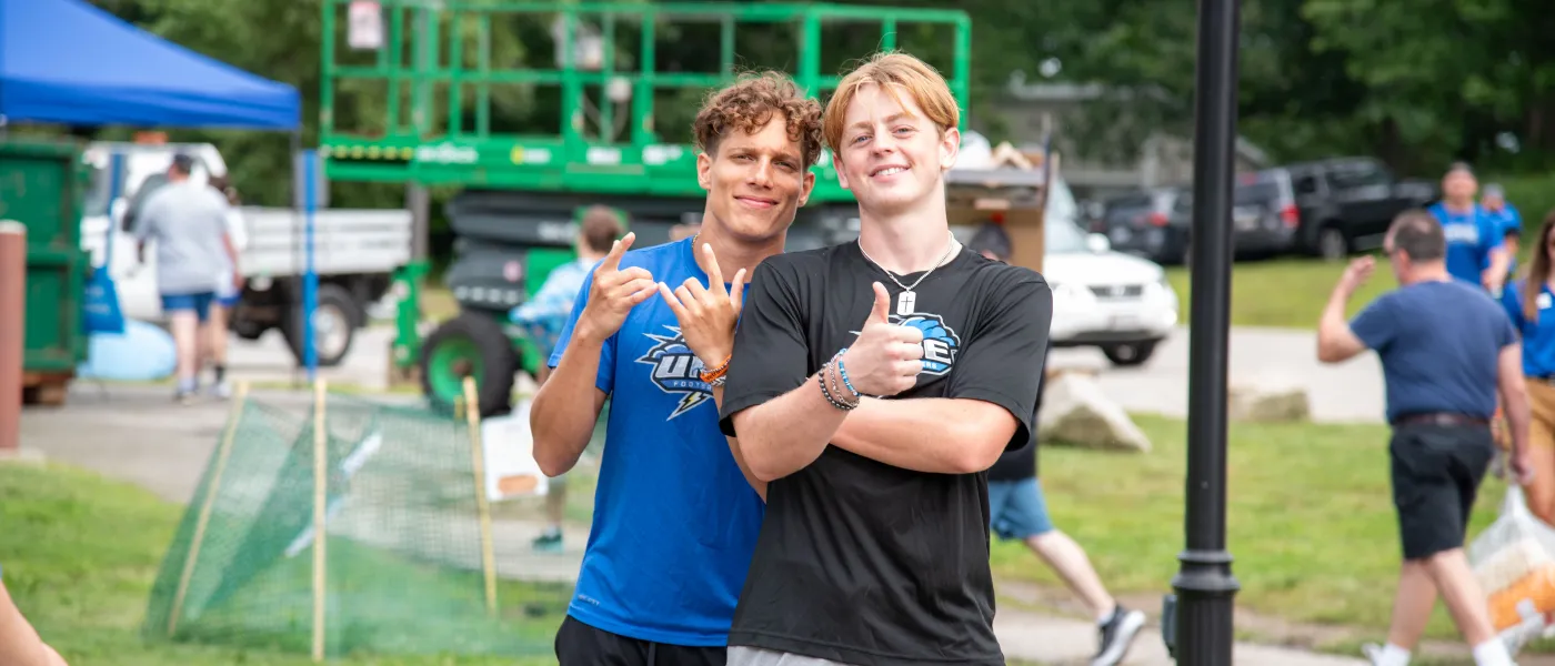 Two male students pose for a photo