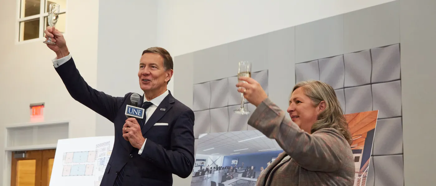 President Herbert raises a toast to the new college of osteopathic medicine on U N E's portland campus