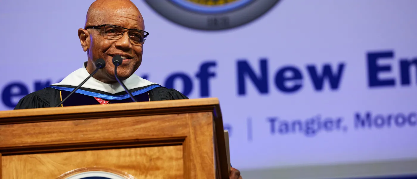 2023 commencement speaker Ronald A. Crutcher stands at the podium