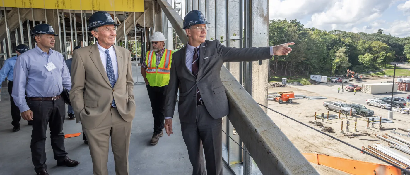 Members of the U N E community take a tour of the construction of the Harold and Bibby Center for Health Sciences on U N E's Biddeford campus