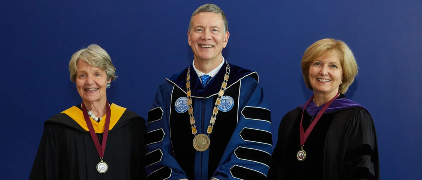 Trish Riley and Andrea Cianchette Maker stand with President Herbert