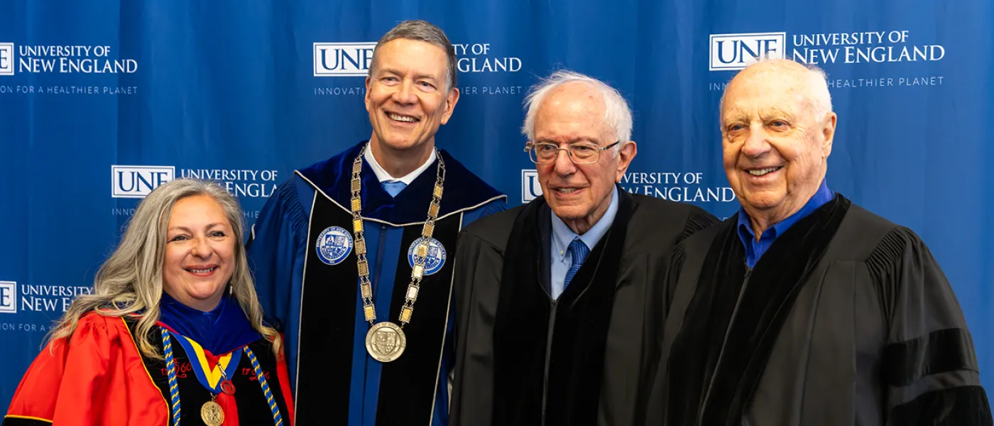Gwendolyn Mahon and James Herbert with the tow U N E honorary degree recipients Bernie Sanders and Arthur P. Girard
