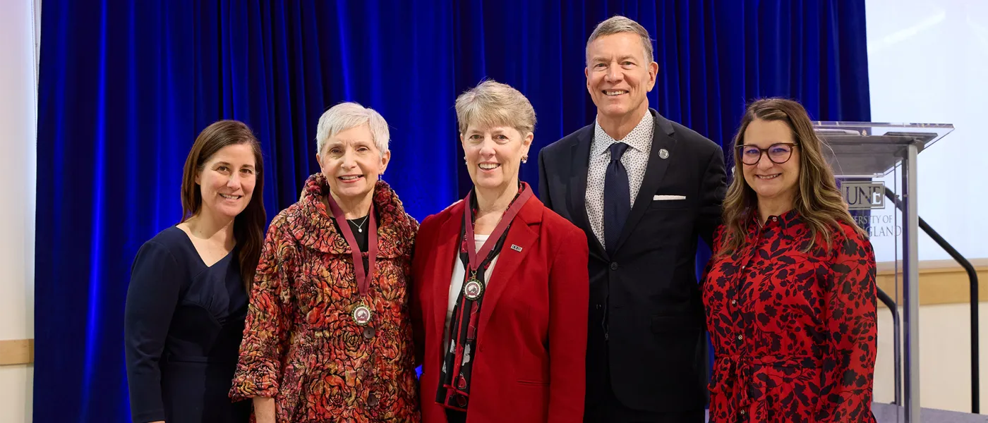 Deborah Morton Society awardees Karin Gregory and Diane Collins Field stand with President James Herbert and two others at the ceremony