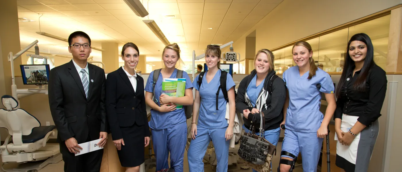 U N E Dental Medicine students pose together inside the Oral Health Center
