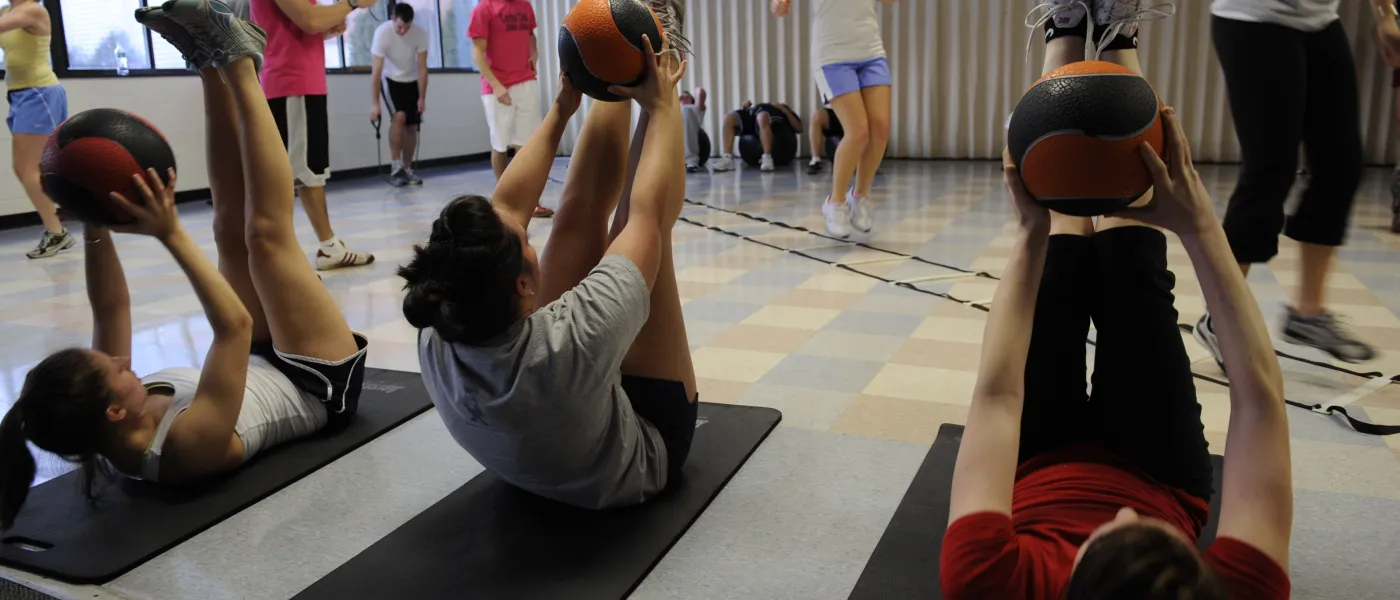 Students participate in a fitness class at the U N E Campus Center