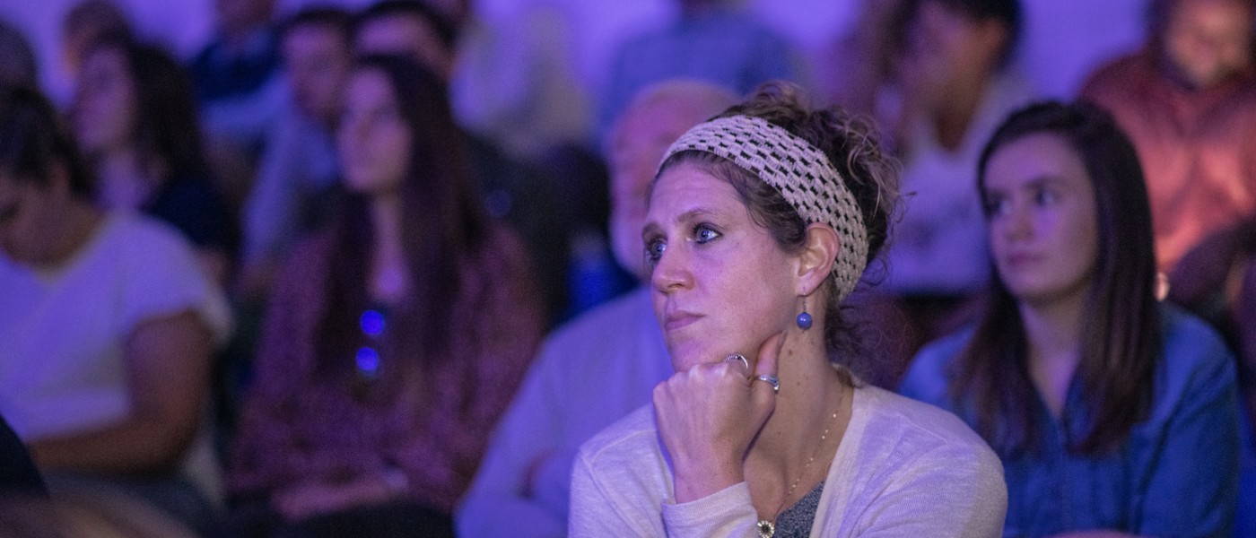 An audience member watches the Bush lecture