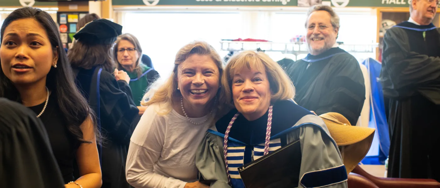 Faculty pose at commencement