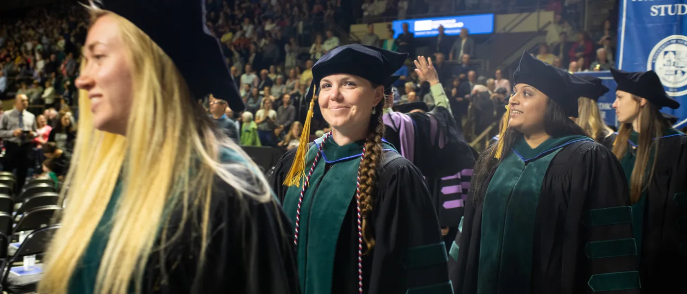 Students walk during commencement