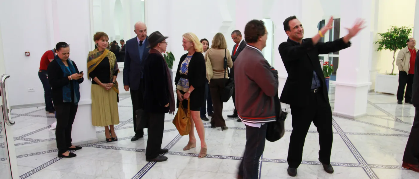 Attendees gather for an evening event at U N E Tangier.