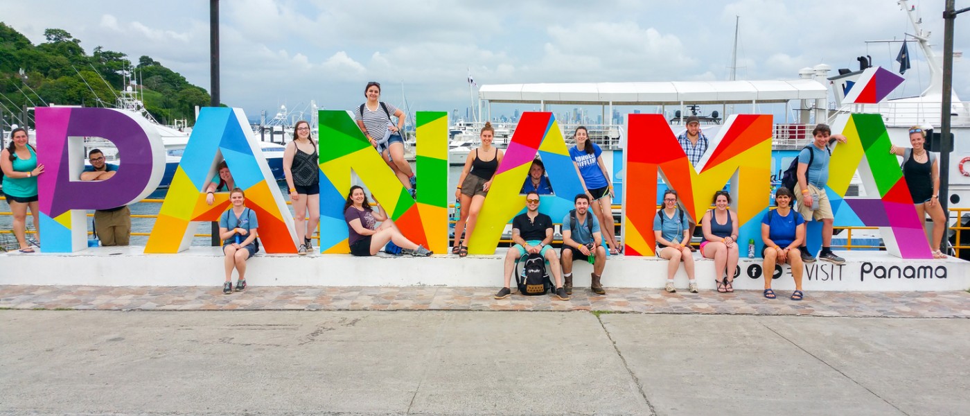 UNE students near Panama Sign