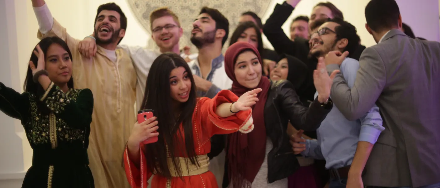 U N E students hosting a party with local college students.