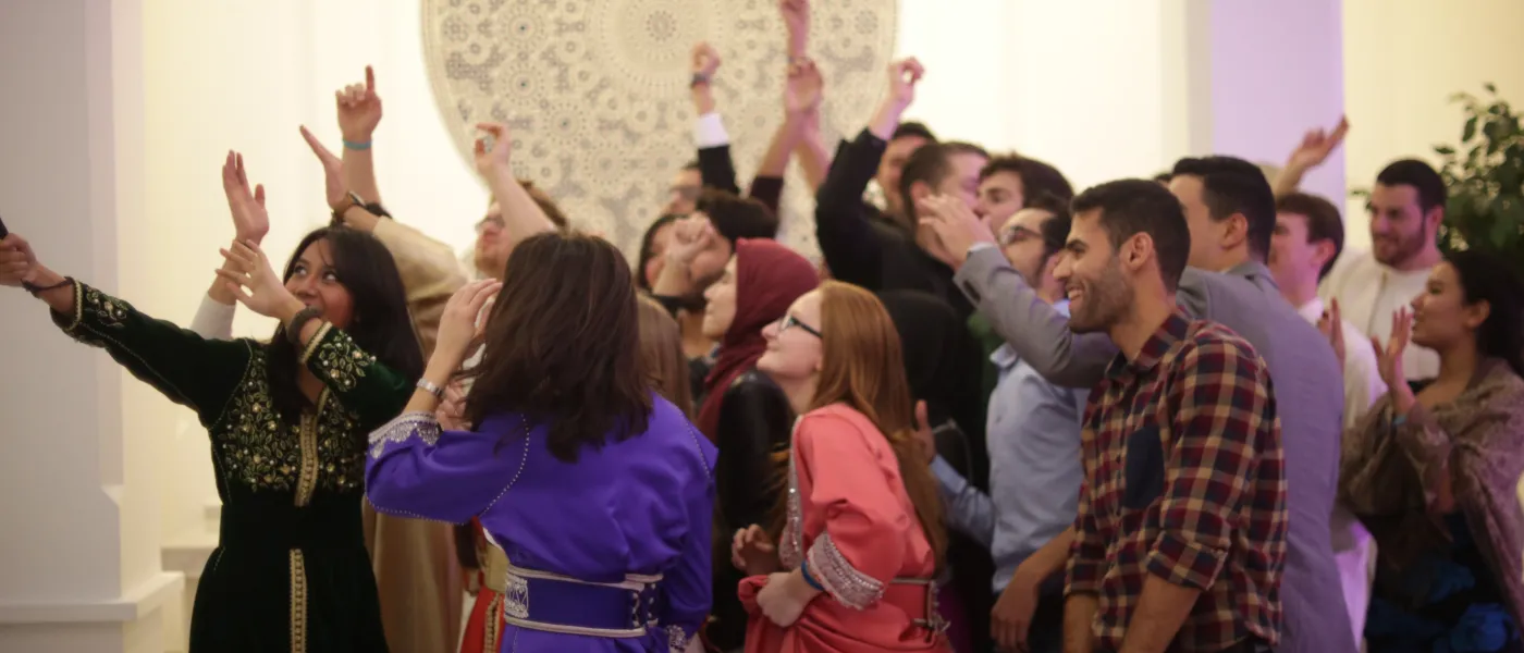 U N E students hosting a party with local college students.