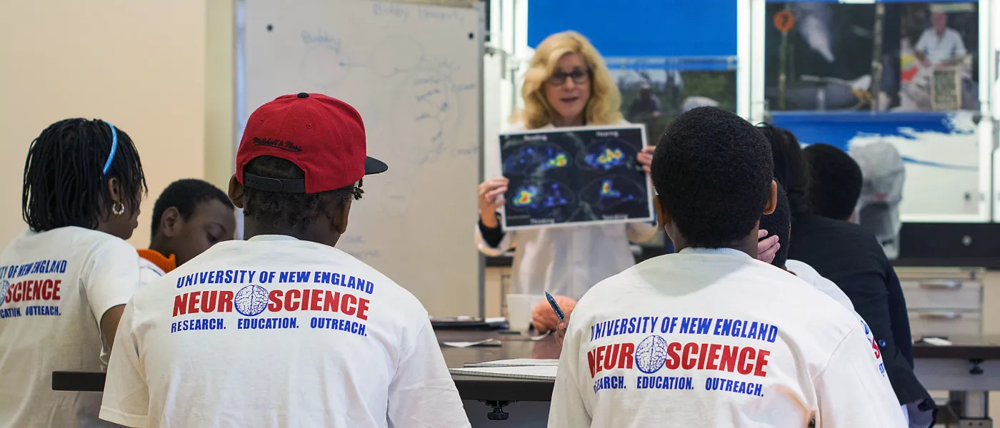 U N E faculty member shares her knowledge with visiting high school students