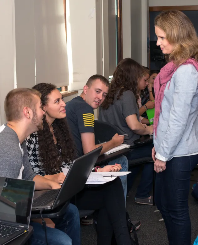 A psychology professor talks to students during a class