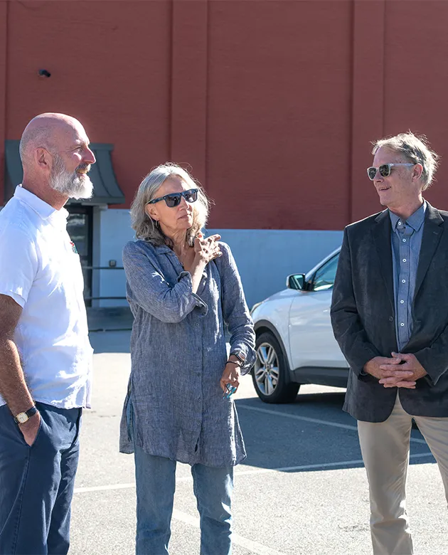 Brad Favreau, Michele Polacsek, Cameron Wake and Delilah Poupore have a conversation in downtown Biddeford. 
