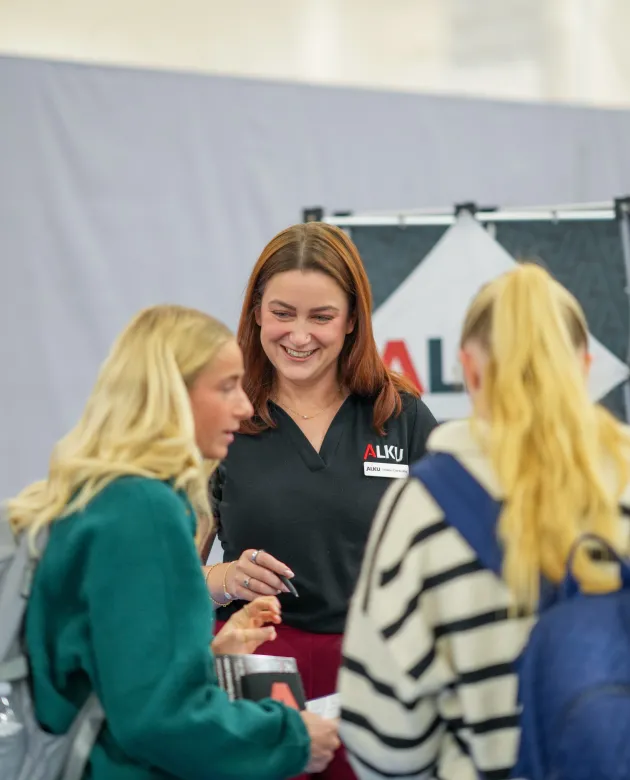 UNE students meet with a representative from the ALKU consulting firm