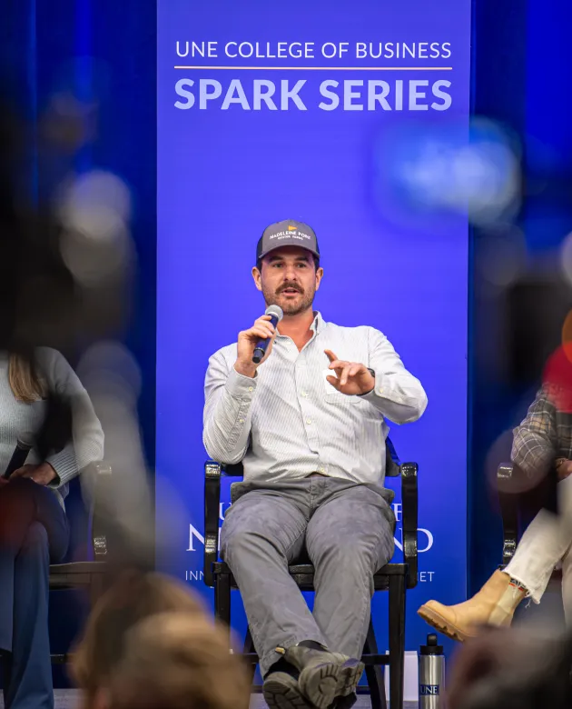 Nate Henninger of Madeleine Point Oyster Farms speaks onstage