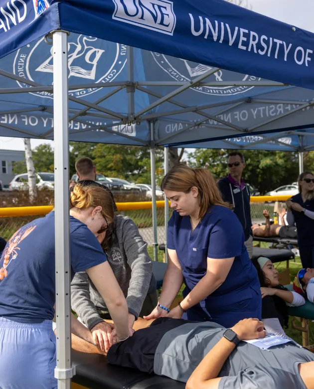 UNE medical students treat runners after the Maine Marathon