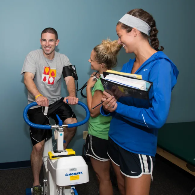 students administer tests on a student athelete