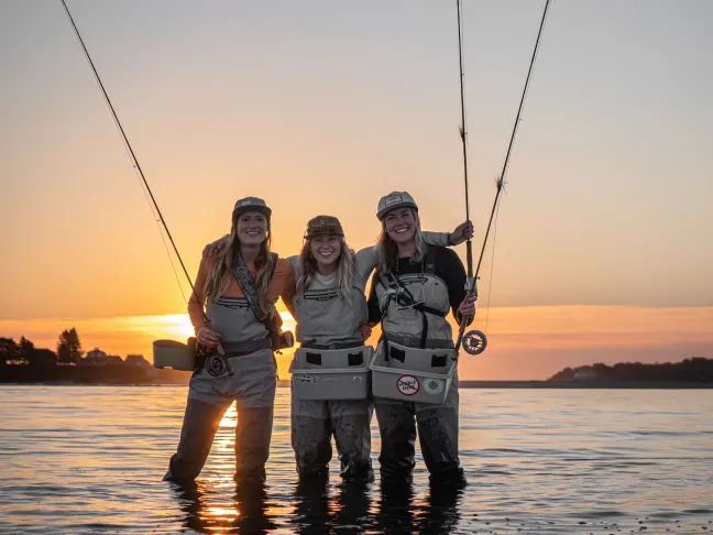 From left: UNE COM Class of 2023 students Hannah Akre, Kelsey Klingel, and Charlie Bloom — or, as they are known online, the Fishin’ Physicians.