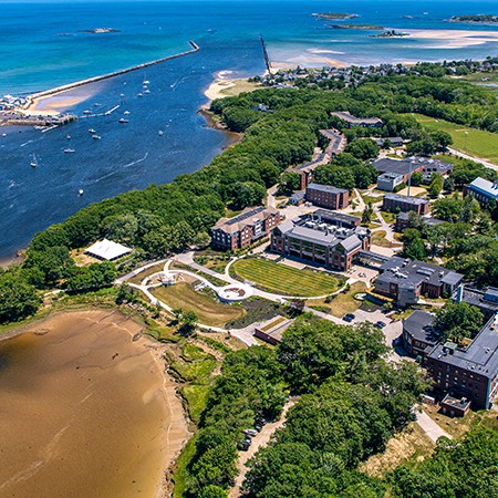 An aerial photo showing part of the Biddeford Campus and the Atlantic Ocean