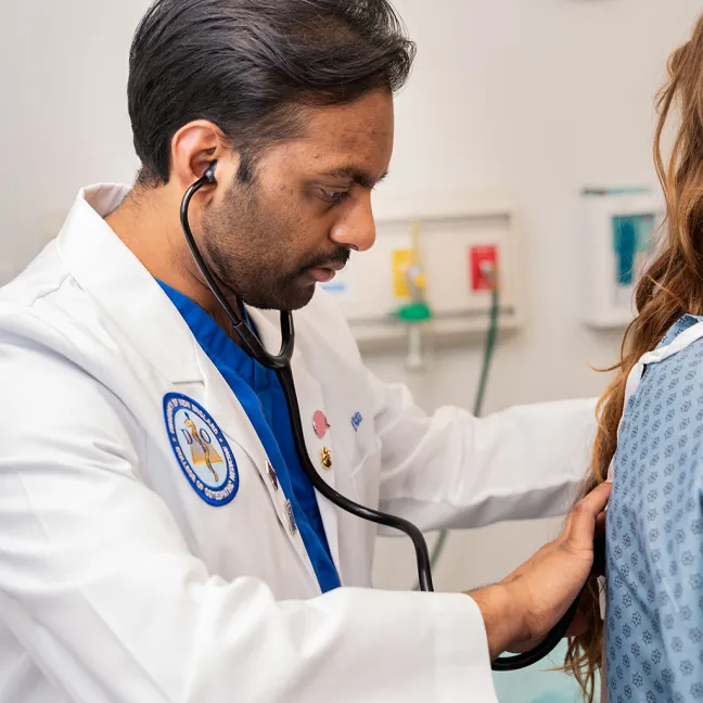 A U N E student works in the clinical performance center