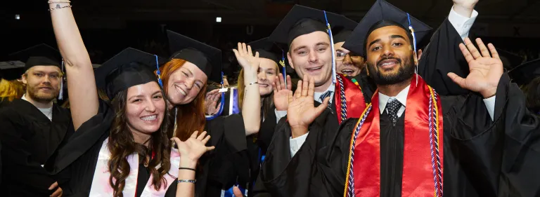 U N E Students walk down the aisle during the 2025 graduation ceremony