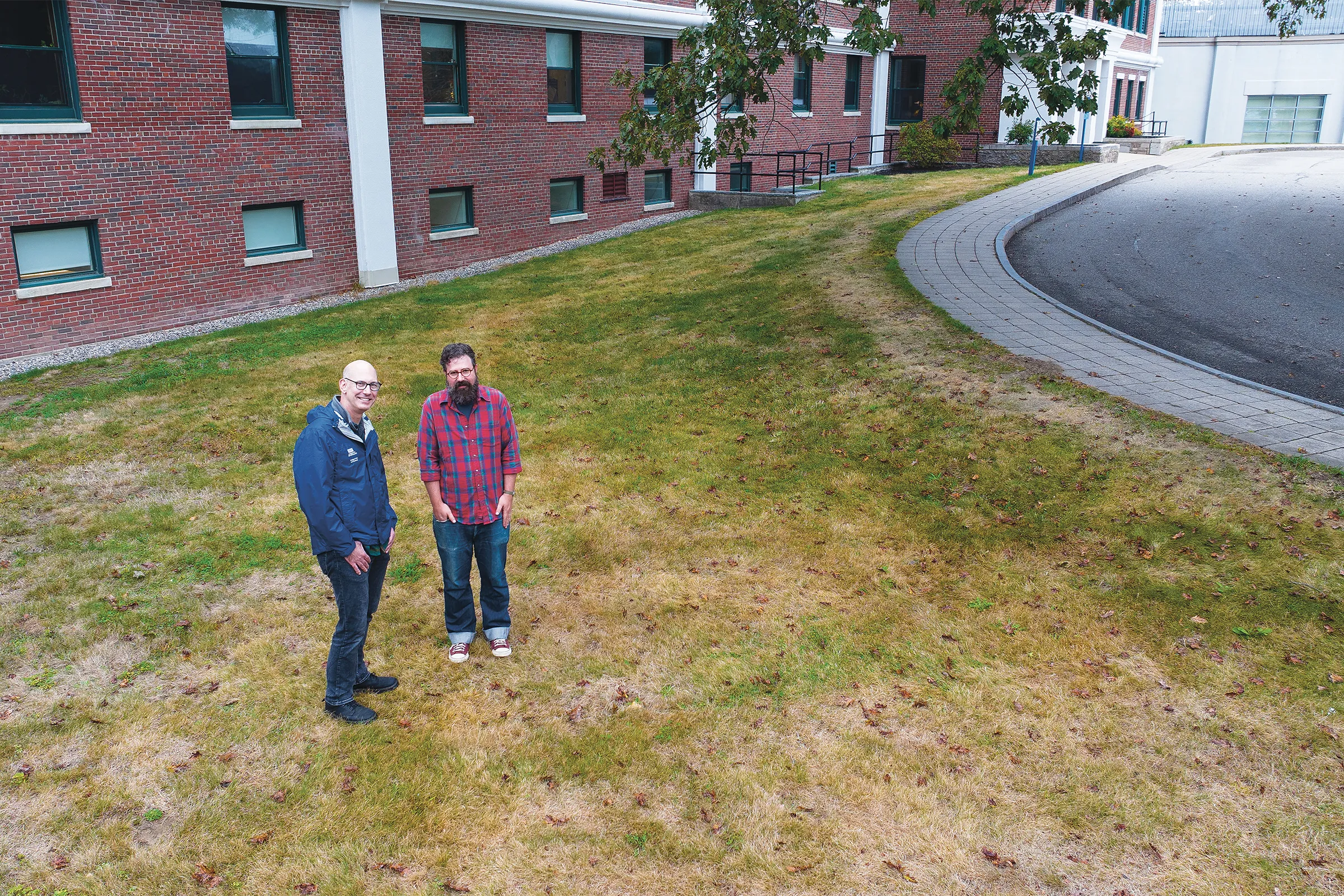 Arthur Anderson (left) and Eric Zuelow (right) stand in front of Decary Hall