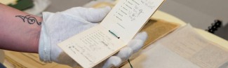 A person examines historical documents