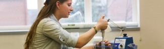 A student works in a biology lab