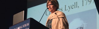 Susan Lindee speaks from a podium at the Tangier Global Forum