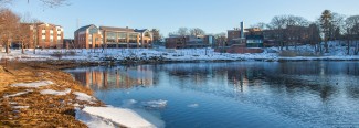 View of Biddeford Campus on the water and with snow