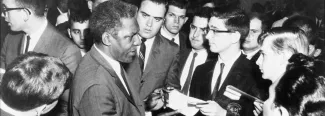 Bayard Rustin signing autographs