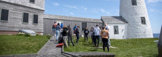 A panoramic image of the Wood Island Lighthouse in Biddeford, where several leadership students gather to teach each other survival skills