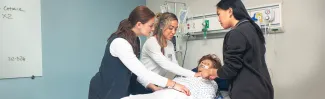 Physical therapy students learning in the UNE simulation lab
