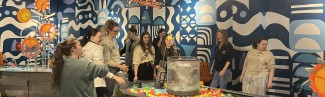 Students play with water mechanisms at the Children's Museum in Portland