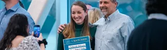 A UNE medical student poses with family on Match Day