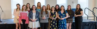 A photo of a group of students posing at the PSI CHI induction